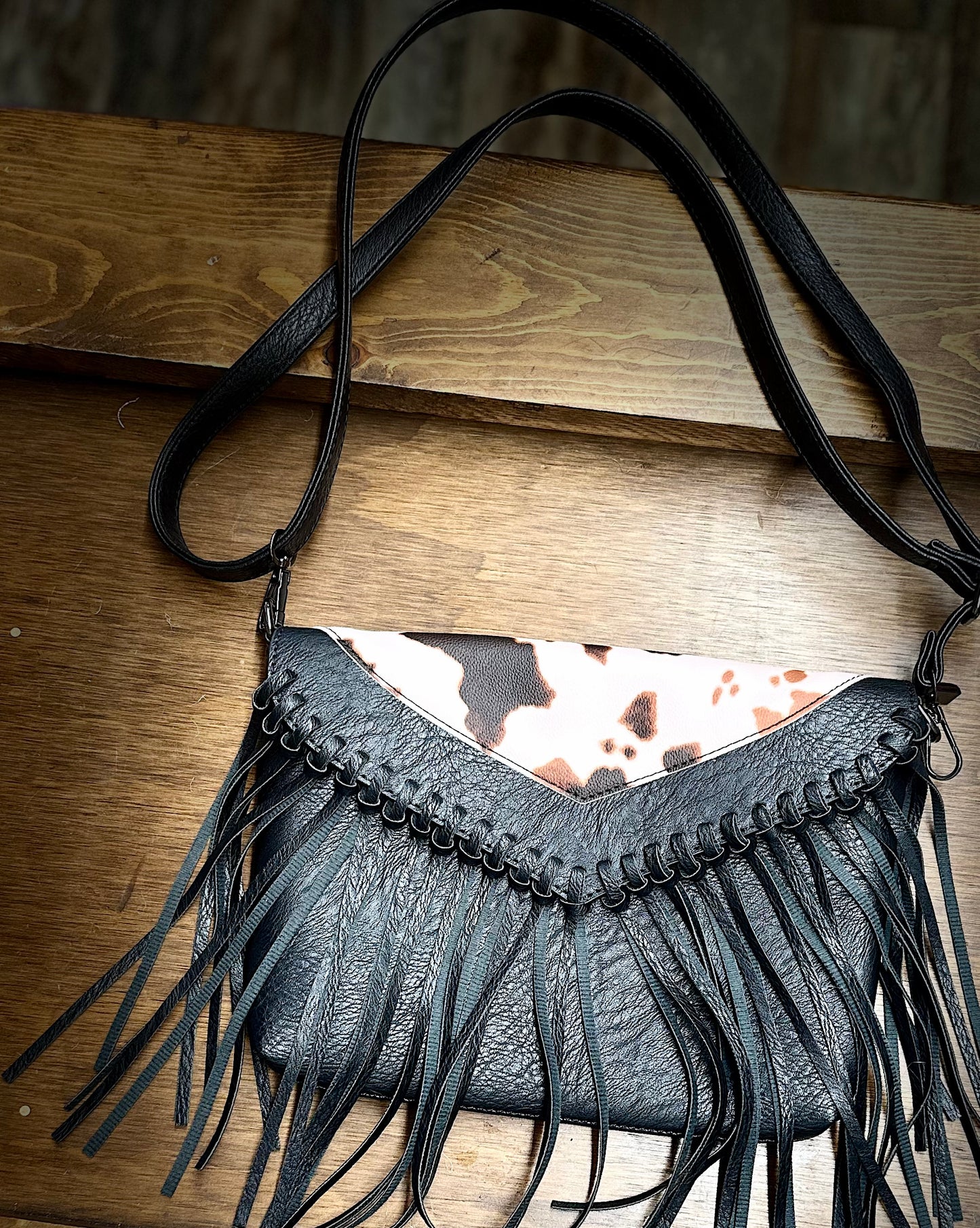 Cow print fringe purse